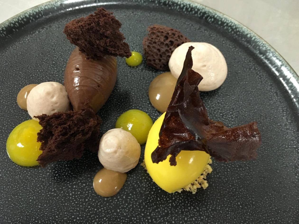 Chocolate cremeaux, chestnut foam , mandarin sorbet and chocolate coral sponge , coffee crème 